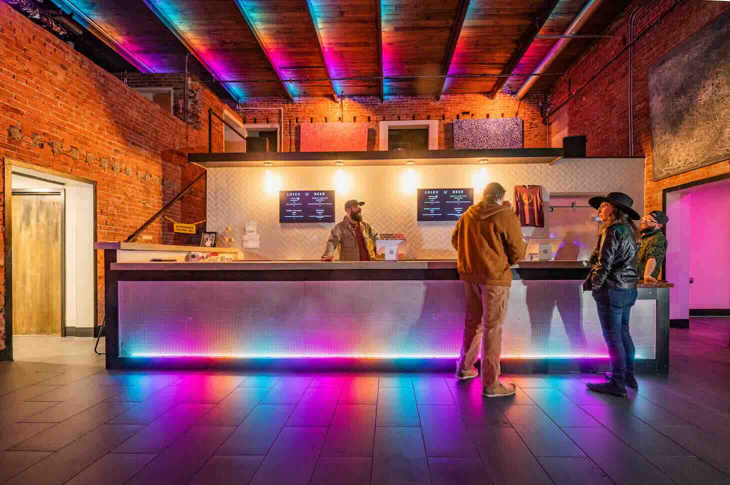 Interior view of Lolev Beer taproom showing bar area with craft beer taps